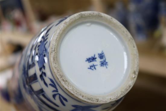 A Chinese 19th century blue and white cylindrical vase and a similar baluster vase, H 31cm (largest)